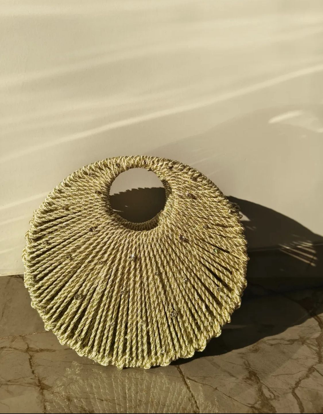 Golden Handwoven Circular Handle Statement Bag