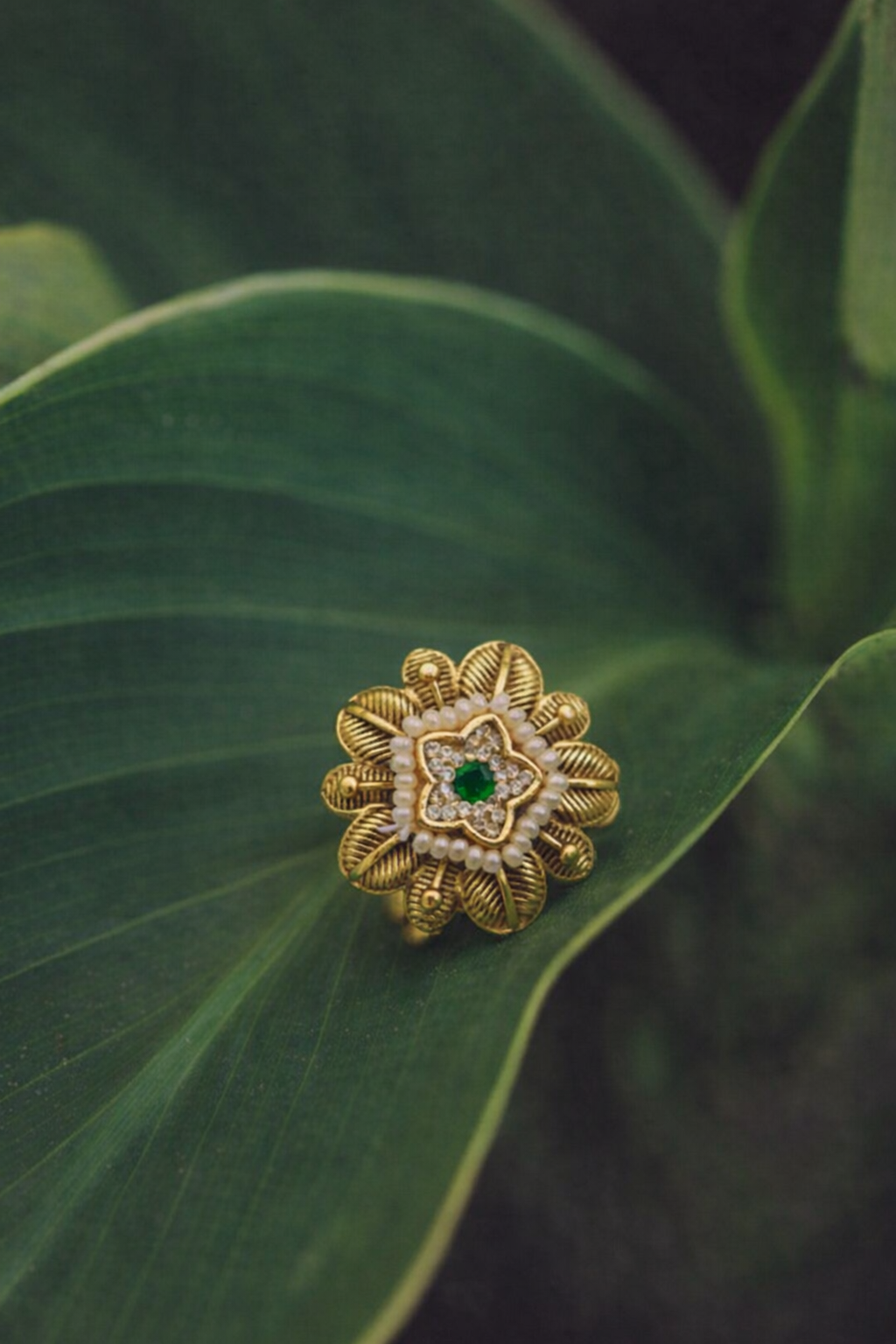 Elegant Floral Gold Ring with Green Stone and Pearl Detailing