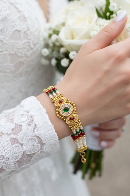 Traditional Pearl Beaded Gold Bracelet with Ruby & Emerald Stone Design