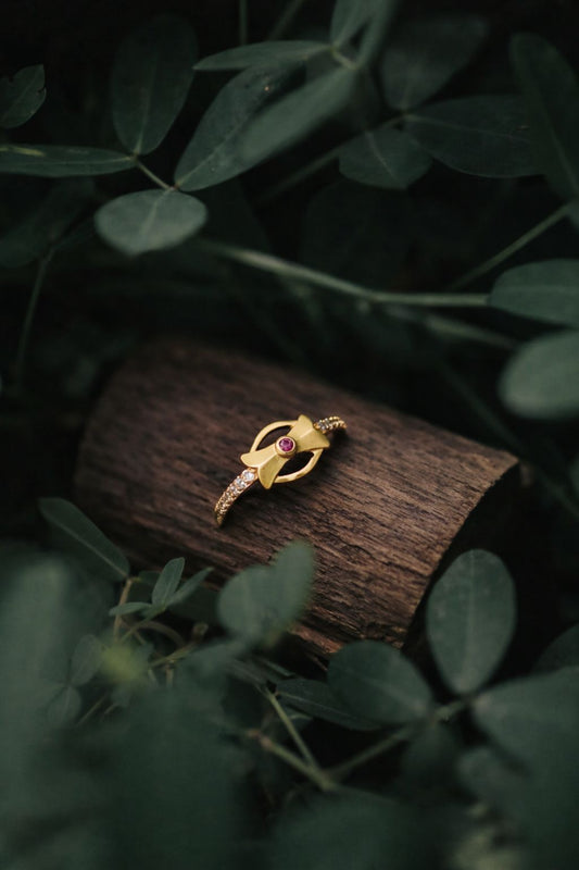 Elegant Bow Design Gold Ring with Ruby Center Stone