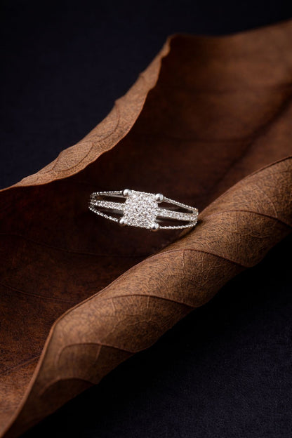 Elegant White Gold Diamond Cluster Ring with Split Pavé Band