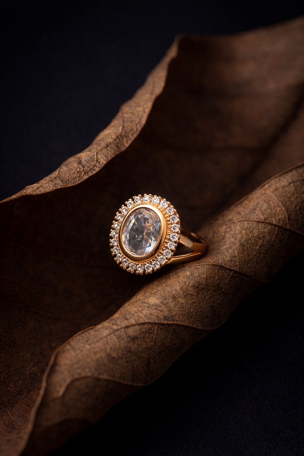 Elegant Gold Oval-Cut Diamond Ring with Halo Setting