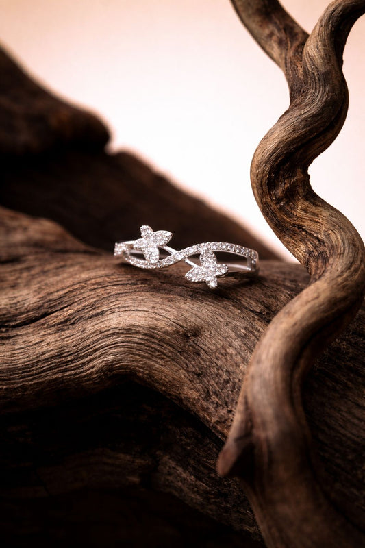 Elegant White Gold Diamond Infinity Ring with Dual Floral Motifs