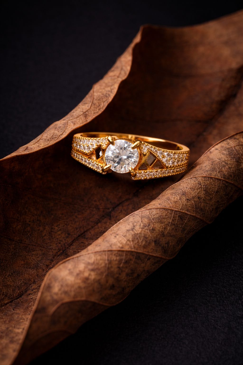 Classic Gold Solitaire Diamond Ring with Pavé Accents & Geometric Detailing