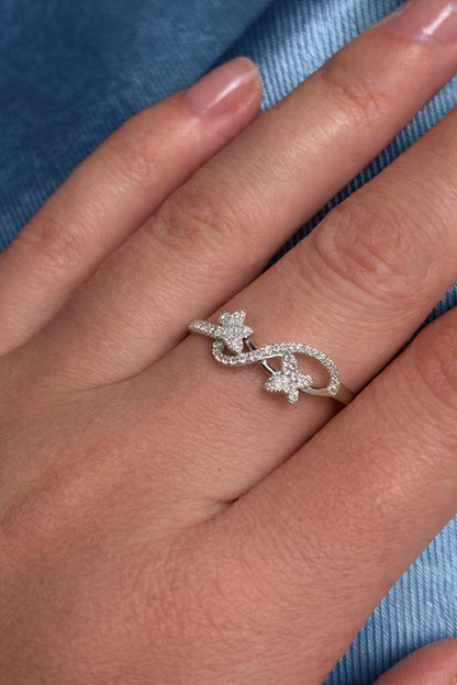 Elegant White Gold Diamond Infinity Ring with Dual Floral Motifs